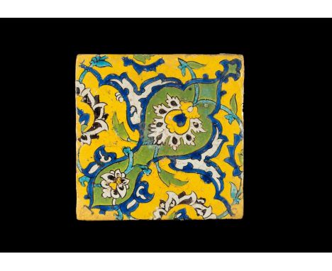 Islamic Art. Safavid cuerda seca pottery tile decorated with palmette over yellow ground  Safavid Iran, 17th century . Cm 22,