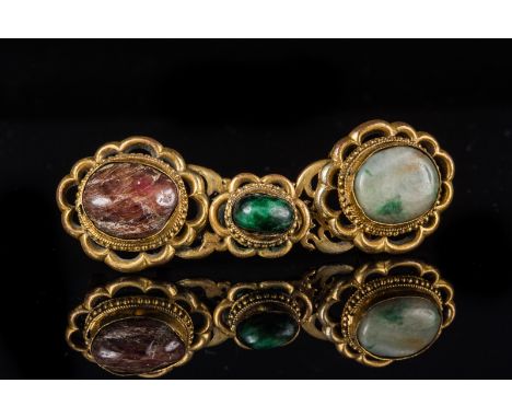 Islamic Art. A gilt bronze belt hook encrusted with ruby root and jade India or Turkey 18th century.. Cm 10,00 x 3,50. 