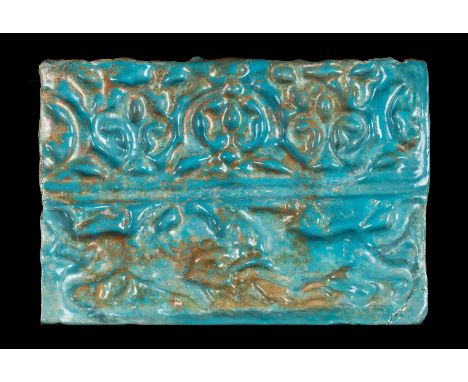 Islamic Art. A Kashan turquoise glazed tile decorated with palmettes and two affronted animals  Seljuk Iran, 12th century . L