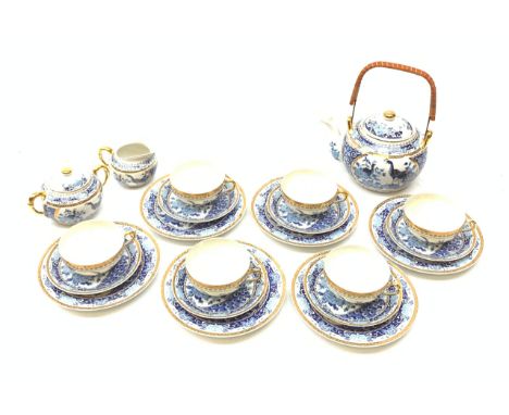 A Japanese eggshell porcelain teaset, comprising six teacups each with Geisha lithophane panel, six saucers, six side plates,