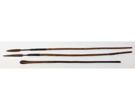  Two tribal hunting spears, one example with bamboo cane, each approx L111cm, together with a club.    - Condition Report 