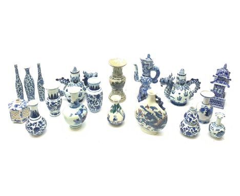  A small Chinese blue and white moon flask, with twin handles, the body decorated with a dragon chasing a flaming pearl amids