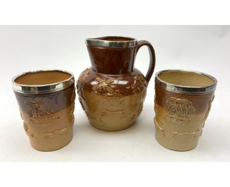  Victorian silver mounted salt-glaze jug with applied hunting and toping scenes and two matching beakers, circa 1880 (3)   - 