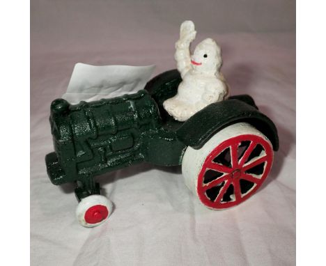 Cast iron Michelin Man on a Tractor figure, L: 12 cm. UK P&amp;P Group 1 (£16+VAT for the first lot and £2+VAT for subsequent