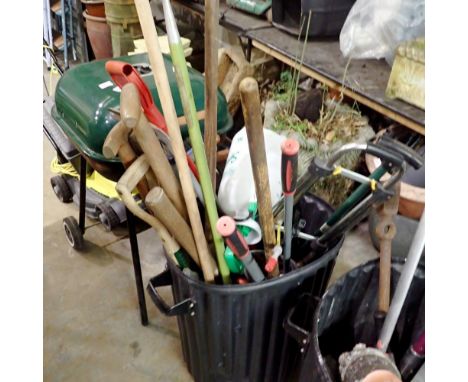 Bin containing a mixed lot of garden tools, including spades, rakes and cutters. Bin NOT included. Not available for in-house