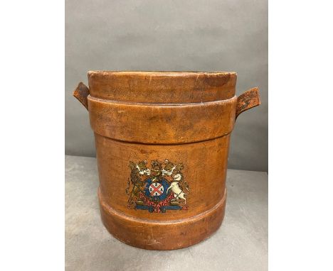 A Leather stick stand with lead lining and crest motif to front H 36cm x D 32cm