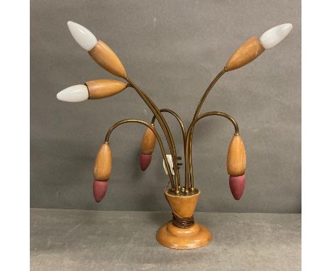 A Mid Century table lamp in a tulip style.