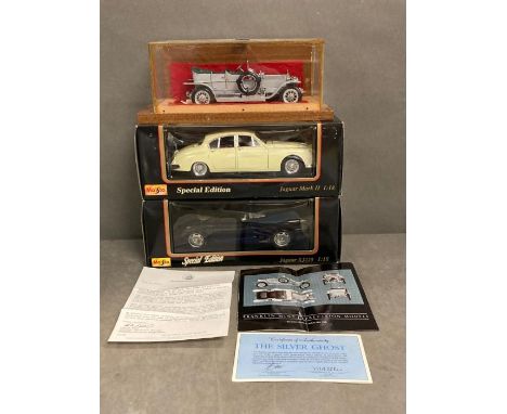A selection of three collectable model cars to include a Franklin Mint Rolls Royce silver ghost with paperwork 