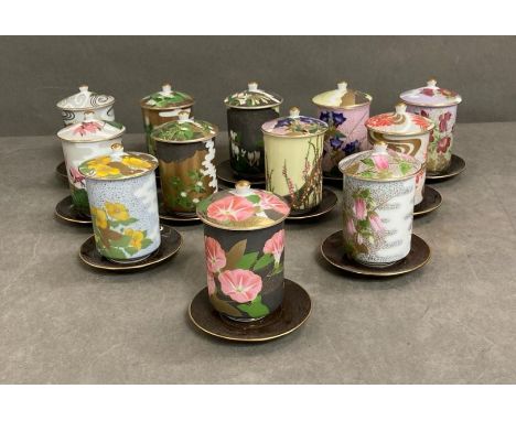 A selection of twelve floral decorated porcelain sake/tea cups and saucers