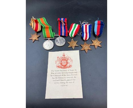 WWII Medals with original box and paperwork to include: The Africa Star with 8th Army Clasp, 1939-1945 Star, Defence Medal, W