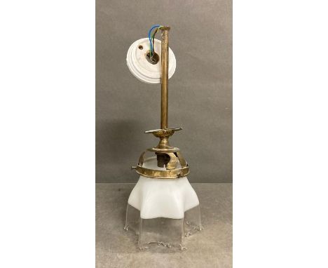 A Victorian brass ceiling light with a two tone glass shade with crimped detailing  