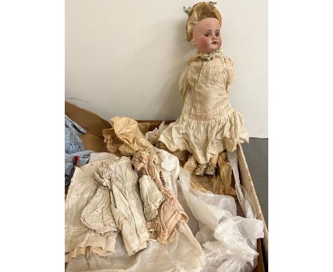 A Vintage doll with original clothes, china face and stamped Paris S F B J BEBES
