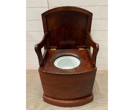A mahogany commode with original pot