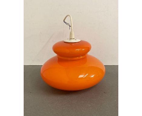 A Mid Century orange ceiling light glass shade