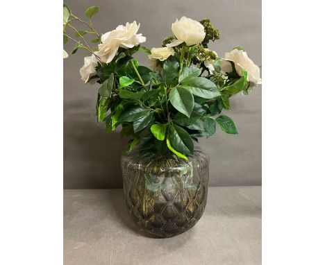 A Danish glass wave vase with faux floral arrangement