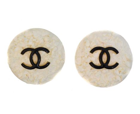 A pair of Chanel earrings, A pair of Chanel earrings, each designed as a textured bakelite disc with maker's black enamel log