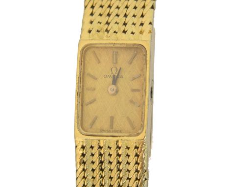 An 18ct gold Omega wristwatch, An 18ct gold Omega wristwatch, the signed rectangular dial with baton markers, cal.730 17 jewe