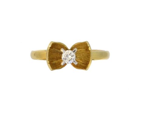 An 18ct gold diamond dress ring, An 18ct gold diamond dress ring, the brilliant cut diamond within a textured bow setting, ha