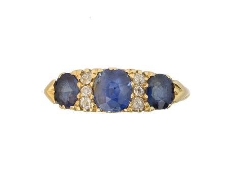 An 18ct gold sapphire and diamond dress ring, An 18ct gold sapphire and diamond dress ring, the cushion shape sapphire line w