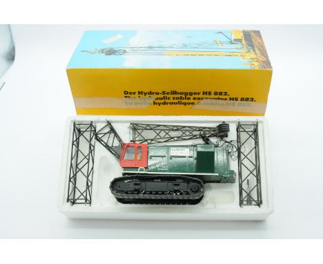 Conrad a boxed 1:50 Scale No.2831 HS882 Hydraulic Cable Excavator "TRI-BORO". Condition is Good to Excellent (unchecked for c