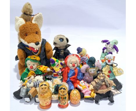 Quantity of porcelain clowns, wooden nesting dolls, and similar, to include Basil Brush glove puppet (maker unknown), and oth