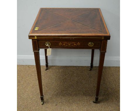 An Edwardian fiddleback mahogany and satinwood banded envelope card table, the swivel top opening to reveal a baize-lined pla