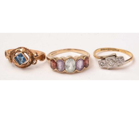 A gem set ring, set with light-blue stone, amethyst and garnet, on 9ct yellow gold shank; a three stone diamond ring, the sha