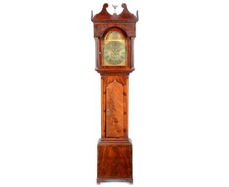 Thomas Atkinson, Gateshead: a 19th Century flame mahogany longcase clock, the arched brass roman dial, with outer arabic minu