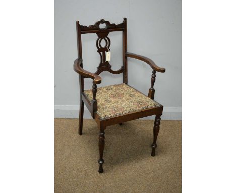 A late 19th C mahogany armchair, by C.R. Light, with undulating top rail, pierced vasiform splat, outswept arms, above a padd