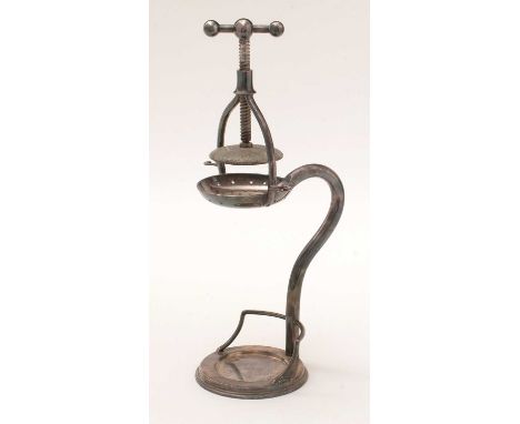 An early 20th Century plated lemon squeezer, by Henry Wilkinson &amp; Co., with screw mount above a pierced pan on shaped ste