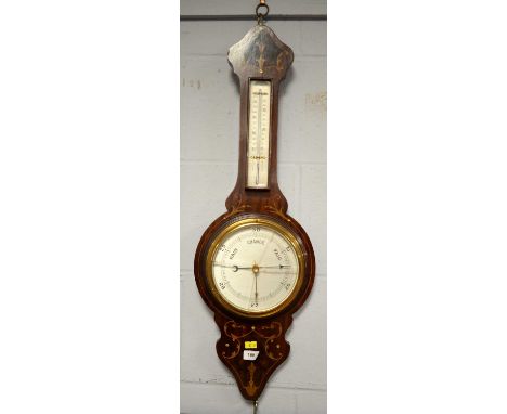 An early 20th Century inlaid mahogany wheel barometer, 71cms high. 