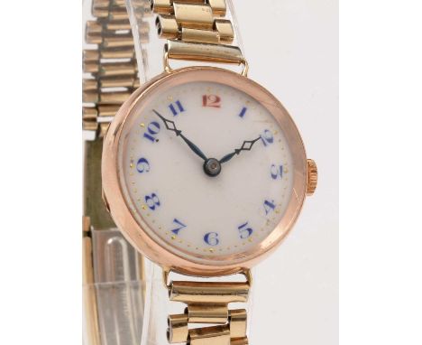A 9ct yellow gold cased wristwatch, the white enamel roman dial with manual wind movement. 