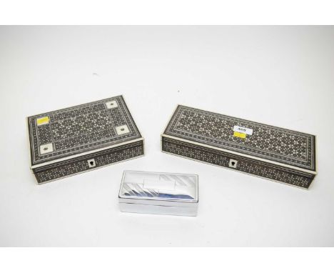 Two Vizagapatam boxes, each of rectangular form, the largest 28cms wide; and a Wilkinson Sword razor blade, in box. (3)  