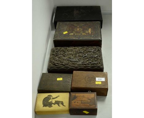 A selection of trinket and cigarette boxes, including: a Japanese ebonised wood box of rectangular form, the hinged decorated