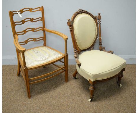An early 20th Century inlaid satinwood ladder back occasional chair; and a Victorian walnut nursing chair.  (2)