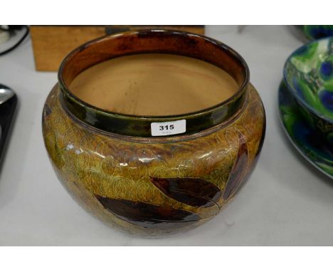 A Royal Doulton planter, decorated with branches of leaves, impressed marks to base, 26cms diameter.