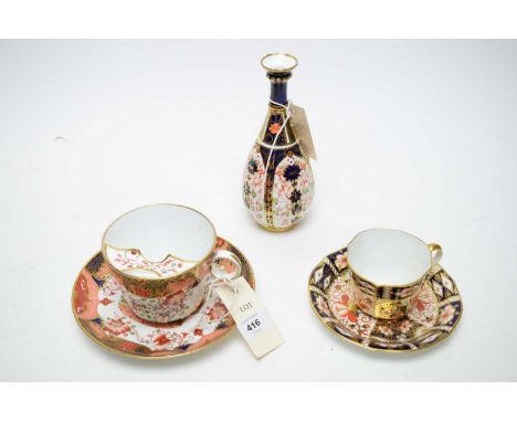 A Royal Crown Derby Imari pattern vase, No. 1128, 18.5cms high; together with a Royal Crown Derby teacup and saucer, pattern 