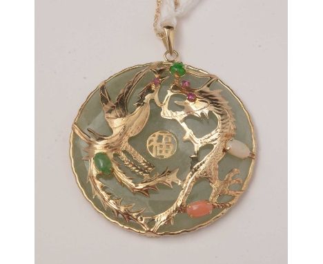 A Chinese jade coloured stone and gemstone pendant, of roundel form with dragon and phoenix mounts set with opal, coral, red 