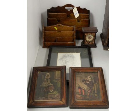 Two stained oak letter racks, the larger 30cms wide; together with a British United Clock Company miniature mantel clock; a f