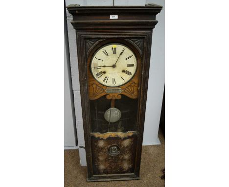 A Bundy time recorder wall clock, circa 1900, 46 x 120cms.