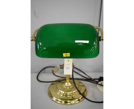 An early 20th Century brass desk lamp with green glass shade, 36cms high.