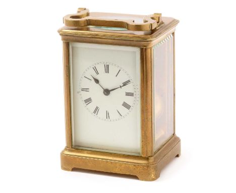 A late 19th Century carriage clock, the white enamel roman dial fitted a movement with platform lever escapement striking on 