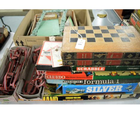 An assorted collection of board games and toys, including: Scrabble, Cluedo, Waddingtons Formula 1; a Tank Commando game; an 