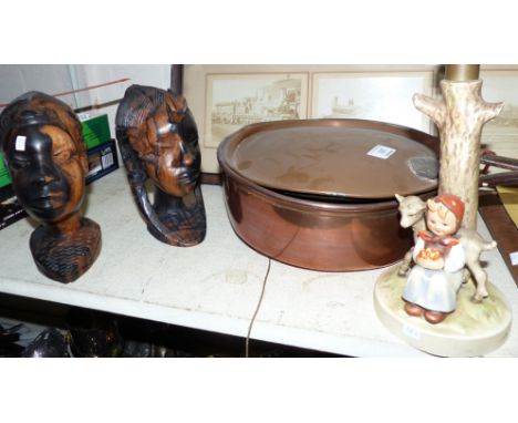 A copper saucepan and warming pan; a Hummel table lamp; African carvings; bric-a-brac