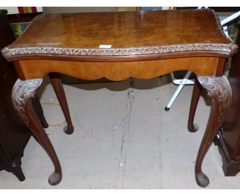 A Georgian style burr walnut card table with green baize playing surface, on cabriole legs, width 33"