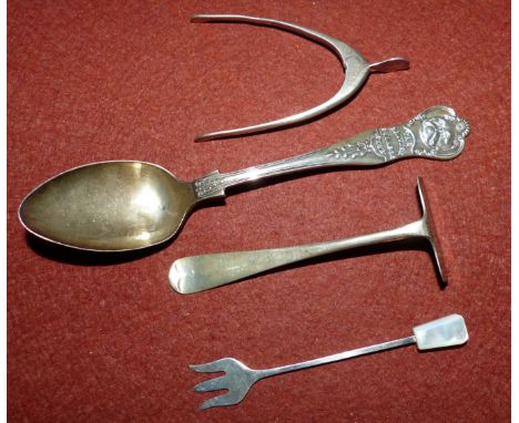 Four items of hallmarked silver:  a child's push and a pair of sugar nips, Birmingham 1931; a spoon, Birmingham 1925; a small