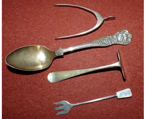 Four items of hallmarked silver:  a child's push and a pair of sugar nips, Birmingham 1931; a spoon, Birmingham 1925; a small