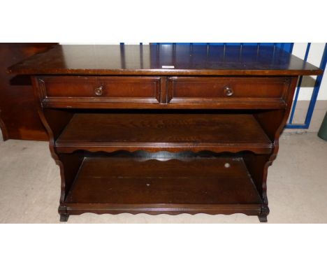 An oak hall table with drawer and shelf under