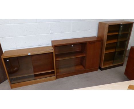 A 1970's teak bookcase/side cabinet; 2 light oak bookcases