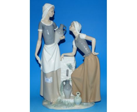 A large Nao porcelain figure group of 2 young women at a well, 15¾"